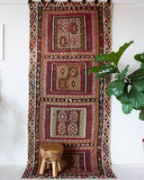 Vintage kilim rug in living room setting, old rug, antique rug, pastel colors, faded colors, Turkish rug, vintage rug, soft rug, Portland, Oregon, rug store, rug shop, local shop, earthy tones, earthy colors, warm colors