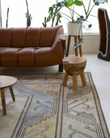 Vintage Turkish rug in living room setting, old rug, antique rug, pastel colors, faded colors, Turkish rug, vintage rug, soft rug, Portland, Oregon, rug store, rug shop, local shop