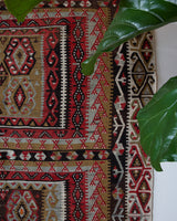 Vintage kilim rug in living room setting, old rug, antique rug, pastel colors, faded colors, Turkish rug, vintage rug, soft rug, Portland, Oregon, rug store, rug shop, local shop, earthy tones, earthy colors, warm colors