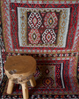 Vintage kilim rug in living room setting, old rug, antique rug, pastel colors, faded colors, Turkish rug, vintage rug, soft rug, Portland, Oregon, rug store, rug shop, local shop, earthy tones, earthy colors, warm colors