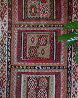 Vintage kilim rug in living room setting, old rug, antique rug, pastel colors, faded colors, Turkish rug, vintage rug, soft rug, Portland, Oregon, rug store, rug shop, local shop, earthy tones, earthy colors, warm colors