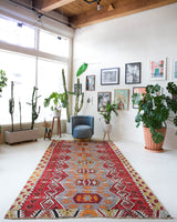 Vintage kilim rug in room decor setting, old rug, antique rug, pastel colors, faded colors, Turkish rug, vintage rug, soft rug, Portland, Oregon, rug store, rug shop, local shop, bold colors, bright colors, faded colors