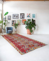 Vintage kilim rug in room decor setting, old rug, antique rug, pastel colors, faded colors, Turkish rug, vintage rug, soft rug, Portland, Oregon, rug store, rug shop, local shop, bold colors, bright colors, faded colors