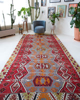 Vintage kilim rug in room decor setting, old rug, antique rug, pastel colors, faded colors, Turkish rug, vintage rug, soft rug, Portland, Oregon, rug store, rug shop, local shop, bold colors, bright colors, faded colors