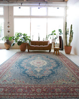 Vintage Turkish rug in a living room setting, pile rug, Turkish rug, vintage rug, portland, rug shop, bright colors, wild shaman, soft rug, bold color, Portland, Oregon, rug store, rug shop, local shop, antique rug