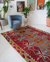 Vintage kilim rug in room decor setting, old rug, antique rug, pastel colors, faded colors, Turkish rug, vintage rug, soft rug, Portland, Oregon, rug store, rug shop, local shop, bold colors, bright colors, faded colors