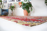 Vintage kilim rug in room decor setting, old rug, antique rug, pastel colors, faded colors, Turkish rug, vintage rug, soft rug, Portland, Oregon, rug store, rug shop, local shop, bold colors, bright colors, faded colors