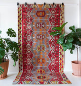 Vintage kilim rug in room decor setting, old rug, antique rug, pastel colors, faded colors, Turkish rug, vintage rug, soft rug, Portland, Oregon, rug store, rug shop, local shop, bold colors, bright colors, faded colors