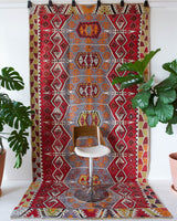 Vintage kilim rug in room decor setting, old rug, antique rug, pastel colors, faded colors, Turkish rug, vintage rug, soft rug, Portland, Oregon, rug store, rug shop, local shop, bold colors, bright colors, faded colors