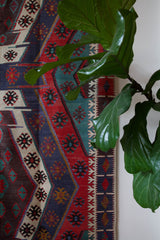 Vintage kilim rug in living room setting, bright colors, wild shaman, soft rug, bold color, Portland, Oregon, rug store, rug shop, local shop, vintage rug, modern kilim, warm colors