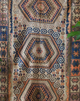Vintage kilim rug in room decor setting, old rug, antique rug, pastel colors, faded colors, Turkish rug, vintage rug, soft rug, Portland, Oregon, rug store, rug shop, local shop, bold colors, bright colors, faded colors