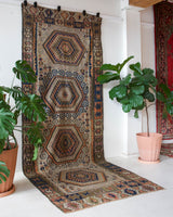 Vintage kilim rug in room decor setting, old rug, antique rug, pastel colors, faded colors, Turkish rug, vintage rug, soft rug, Portland, Oregon, rug store, rug shop, local shop, bold colors, bright colors, faded colors