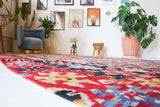 Vintage kilim rug in living room setting, bright colors, wild shaman, soft rug, bold color, Portland, Oregon, rug store, rug shop, local shop, vintage rug, modern kilim, warm colors
