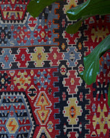 Vintage kilim rug in living room setting, bright colors, wild shaman, soft rug, bold color, Portland, Oregon, rug store, rug shop, local shop, vintage rug, modern kilim, warm colors