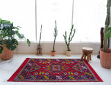 Vintage Turkish rug in a living room setting, pile rug, Turkish rug, vintage rug, portland, rug shop, bright colors, wild shaman, soft rug, bold color, Portland, Oregon, rug store, rug shop, local shop, antique rug