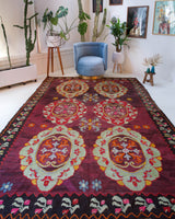 Vintage kilim rug in room decor setting, old rug, antique rug, pastel colors, faded colors, Turkish rug, vintage rug, soft rug, Portland, Oregon, rug store, rug shop, local shop, bold colors, bright colors, faded colors