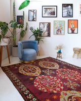 Vintage kilim rug in room decor setting, old rug, antique rug, pastel colors, faded colors, Turkish rug, vintage rug, soft rug, Portland, Oregon, rug store, rug shop, local shop, bold colors, bright colors, faded colors