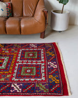 Vintage Turkish rug in a living room setting, pile rug, Turkish rug, vintage rug, portland, rug shop, bright colors, wild shaman, soft rug, bold color, Portland, Oregon, rug store, rug shop, local shop, antique rug