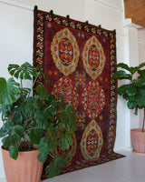 Vintage kilim rug in room decor setting, old rug, antique rug, pastel colors, faded colors, Turkish rug, vintage rug, soft rug, Portland, Oregon, rug store, rug shop, local shop, bold colors, bright colors, faded colors