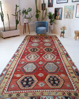 Vintage kilim rug in room decor setting, old rug, antique rug, pastel colors, faded colors, Turkish rug, vintage rug, soft rug, Portland, Oregon, rug store, rug shop, local shop, bold colors, bright colors, faded colors