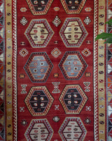 Vintage kilim rug in room decor setting, old rug, antique rug, pastel colors, faded colors, Turkish rug, vintage rug, soft rug, Portland, Oregon, rug store, rug shop, local shop, bold colors, bright colors, faded colors