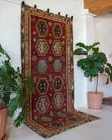 Vintage kilim rug in room decor setting, old rug, antique rug, pastel colors, faded colors, Turkish rug, vintage rug, soft rug, Portland, Oregon, rug store, rug shop, local shop, bold colors, bright colors, faded colors