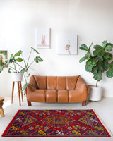 Vintage Turkish rug in a living room setting, pile rug, Turkish rug, vintage rug, portland, rug shop, bright colors, wild shaman, soft rug, bold color, Portland, Oregon, rug store, rug shop, local shop, antique rug