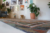 Vintage kilim rug in living room setting, old rug, antique rug, pastel colors, faded colors, Turkish rug, vintage rug, soft rug, Portland, Oregon, rug store, rug shop, local shop, earthy tones, earthy colors, warm colors