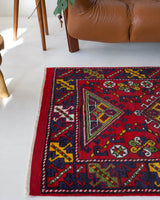 Vintage Turkish rug in a living room setting, pile rug, Turkish rug, vintage rug, portland, rug shop, bright colors, wild shaman, soft rug, bold color, Portland, Oregon, rug store, rug shop, local shop, antique rug