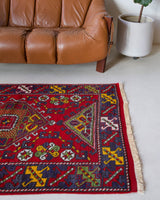 Vintage Turkish rug in a living room setting, pile rug, Turkish rug, vintage rug, portland, rug shop, bright colors, wild shaman, soft rug, bold color, Portland, Oregon, rug store, rug shop, local shop, antique rug