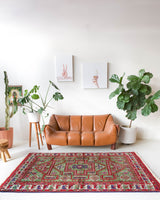 Vintage Turkish rug in a living room setting, pile rug, Turkish rug, vintage rug, portland, rug shop, bright colors, wild shaman, soft rug, bold color, Portland, Oregon, rug store, rug shop, local shop, antique rug, earthy colors