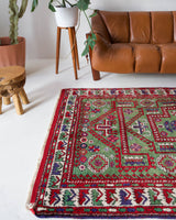 Vintage Turkish rug in a living room setting, pile rug, Turkish rug, vintage rug, portland, rug shop, bright colors, wild shaman, soft rug, bold color, Portland, Oregon, rug store, rug shop, local shop, antique rug, earthy colors