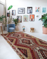 Vintage kilim rug in living room setting, old rug, antique rug, pastel colors, faded colors, Turkish rug, vintage rug, soft rug, Portland, Oregon, rug store, rug shop, local shop, earthy tones, earthy colors, warm colors