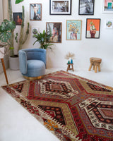 Vintage kilim rug in living room setting, old rug, antique rug, pastel colors, faded colors, Turkish rug, vintage rug, soft rug, Portland, Oregon, rug store, rug shop, local shop, earthy tones, earthy colors, warm colors