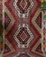 Vintage kilim rug in living room setting, old rug, antique rug, pastel colors, faded colors, Turkish rug, vintage rug, soft rug, Portland, Oregon, rug store, rug shop, local shop, earthy tones, earthy colors, warm colors