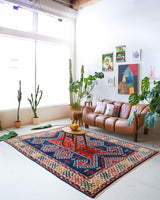 Vintage Turkish rug in a living room setting, pile rug, Turkish rug, vintage rug, portland, rug shop, bright colors, wild shaman, soft rug, bold color, Portland, Oregon, rug store, rug shop, local shop
