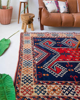 Vintage Turkish rug in a living room setting, pile rug, Turkish rug, vintage rug, portland, rug shop, bright colors, wild shaman, soft rug, bold color, Portland, Oregon, rug store, rug shop, local shop