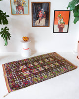 Vintage Turkish rug in a living room setting, pile rug, Turkish rug, vintage rug, portland, rug shop, bright colors, wild shaman, soft rug, bold color, Portland, Oregon, rug store, rug shop, local shop, antique rug