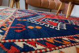 Vintage Turkish rug in a living room setting, pile rug, Turkish rug, vintage rug, portland, rug shop, bright colors, wild shaman, soft rug, bold color, Portland, Oregon, rug store, rug shop, local shop