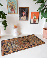 Vintage Turkish rug in a living room setting, pile rug, Turkish rug, vintage rug, portland, rug shop, bright colors, wild shaman, soft rug, bold color, Portland, Oregon, rug store, rug shop, local shop, antique rug