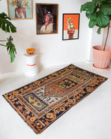 Vintage Turkish rug in a living room setting, pile rug, Turkish rug, vintage rug, portland, rug shop, bright colors, wild shaman, soft rug, bold color, Portland, Oregon, rug store, rug shop, local shop, antique rug