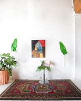 Vintage caucasian rug in a living room setting, pile rug, Turkish rug, vintage rug, portland, rug shop, bright colors, wild shaman, soft rug, bold color, Portland, Oregon, rug store, rug shop, local shop, soft rug, pastel colors, faded colors