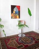 Vintage caucasian rug in a living room setting, pile rug, Turkish rug, vintage rug, portland, rug shop, bright colors, wild shaman, soft rug, bold color, Portland, Oregon, rug store, rug shop, local shop, soft rug, pastel colors, faded colors