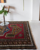 Vintage caucasian rug in a living room setting, pile rug, Turkish rug, vintage rug, portland, rug shop, bright colors, wild shaman, soft rug, bold color, Portland, Oregon, rug store, rug shop, local shop, soft rug, pastel colors, faded colors