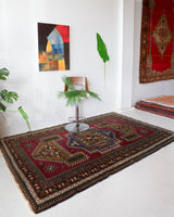 Vintage caucasian rug in a living room setting, pile rug, Turkish rug, vintage rug, portland, rug shop, bright colors, wild shaman, soft rug, bold color, Portland, Oregon, rug store, rug shop, local shop, soft rug, pastel colors, faded colors