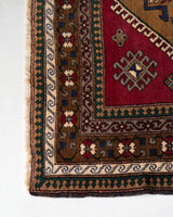 Vintage caucasian rug in a living room setting, pile rug, Turkish rug, vintage rug, portland, rug shop, bright colors, wild shaman, soft rug, bold color, Portland, Oregon, rug store, rug shop, local shop, soft rug, pastel colors, faded colors