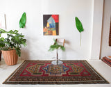 Vintage caucasian rug in a living room setting, pile rug, Turkish rug, vintage rug, portland, rug shop, bright colors, wild shaman, soft rug, bold color, Portland, Oregon, rug store, rug shop, local shop, soft rug, pastel colors, faded colors