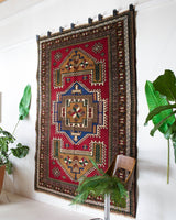 Vintage caucasian rug in a living room setting, pile rug, Turkish rug, vintage rug, portland, rug shop, bright colors, wild shaman, soft rug, bold color, Portland, Oregon, rug store, rug shop, local shop, soft rug, pastel colors, faded colors