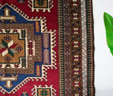 Vintage caucasian rug in a living room setting, pile rug, Turkish rug, vintage rug, portland, rug shop, bright colors, wild shaman, soft rug, bold color, Portland, Oregon, rug store, rug shop, local shop, soft rug, pastel colors, faded colors