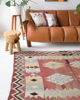 Vintage kilim rug in room decor setting, old rug, antique rug, pastel colors, faded colors, Turkish rug, vintage rug, soft rug, Portland, Oregon, rug store, rug shop, local shop, bold colors, bright colors, faded colors